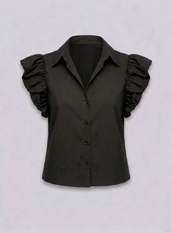 Blusa negra con mangas abullonadas